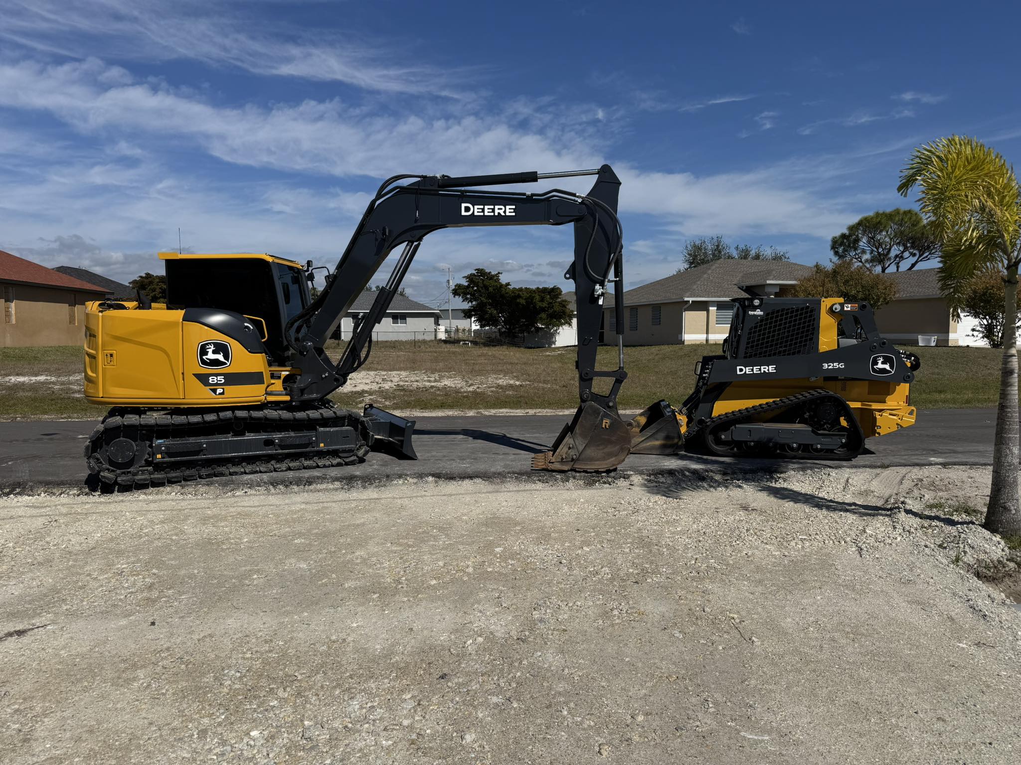 Butler's John Deere excavator and track loader on a Cape Coral job site